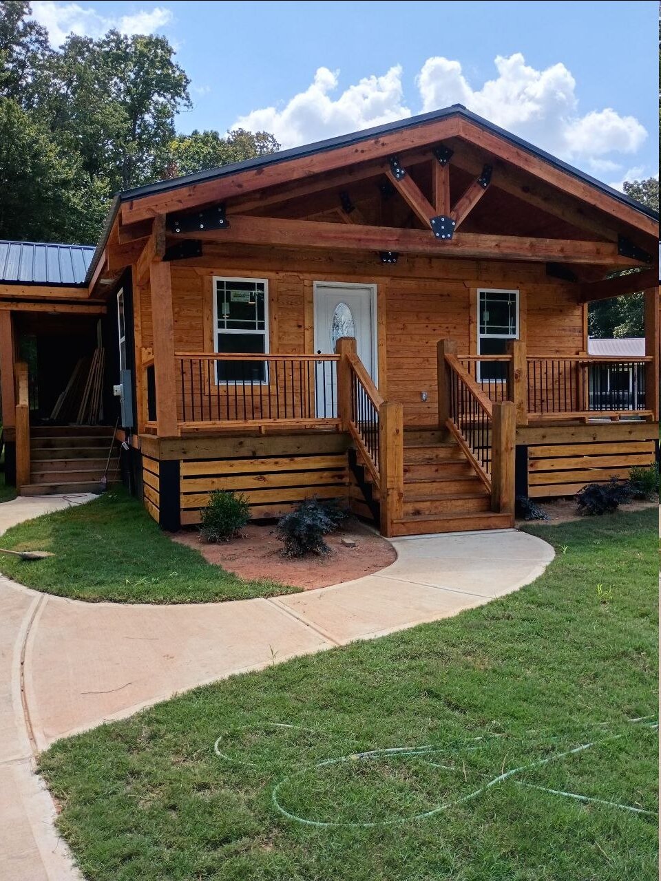 Timber entry porch with steps and railings