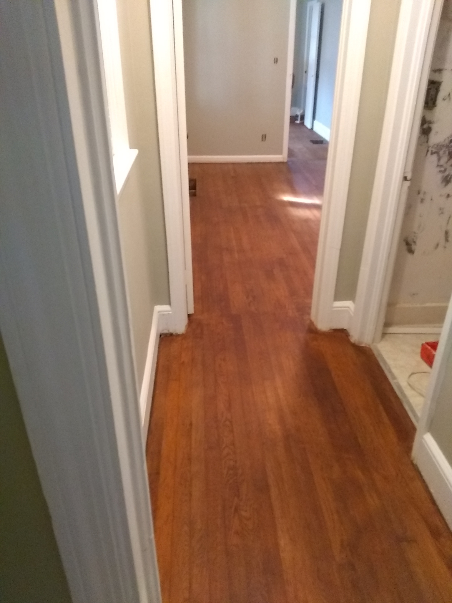 Installed wood flooring through a hallway