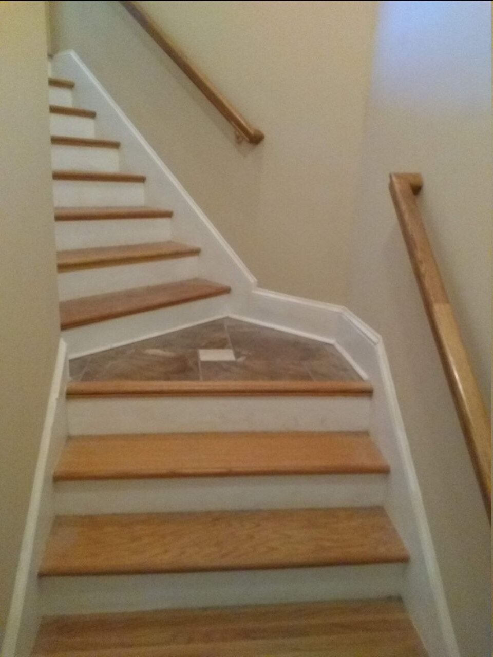 Wood stair treads, tile landing and handrails